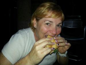 Photo by: Athena Skapinakis Tammy Weidmann enjoys her grilled chicken sandwich.